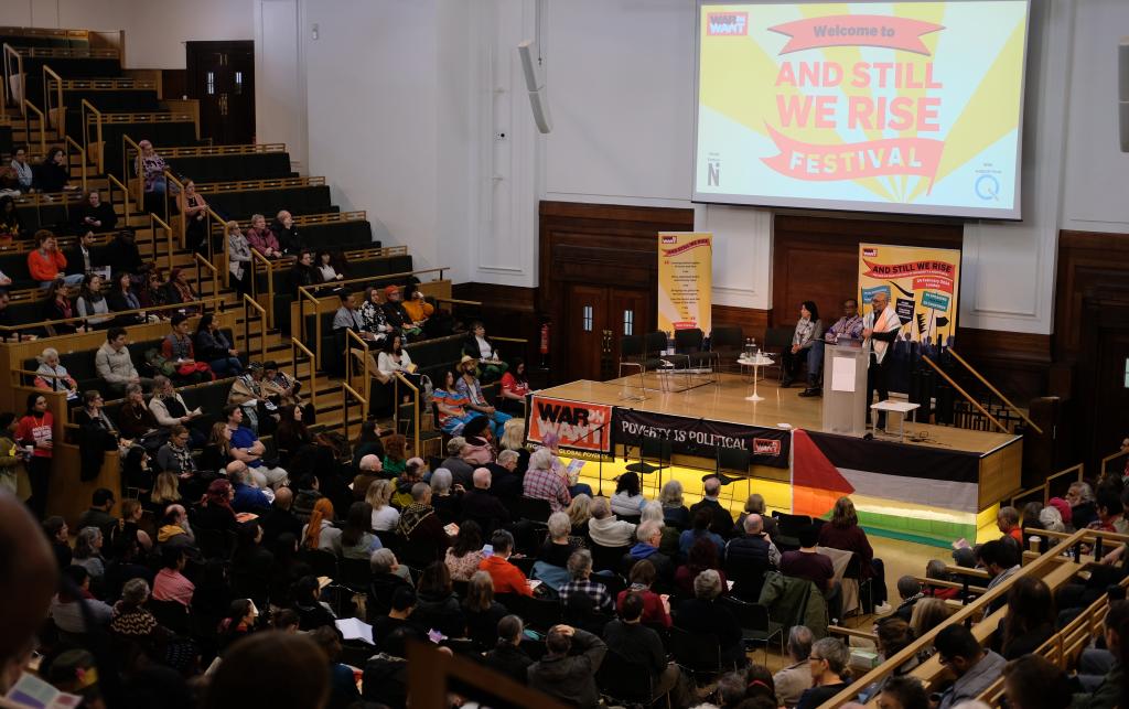 Crowds of people gathered in the auditorium at the opening ceremony of 'And Still We Rise' festival